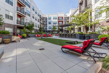 Sundeck with lounge seating, firepit & lawn games